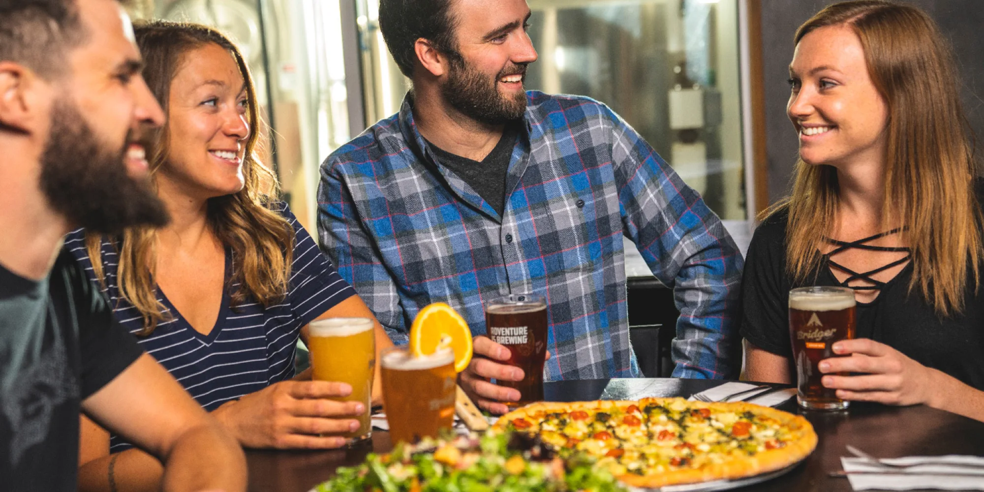 5dcf3b4ec5a7edde734f7840 home page friends enjoying craft beer pizza bozeman montana